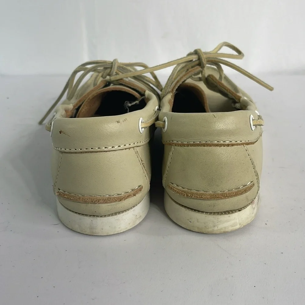 Minnetonka cream leather boat shoes, white sole